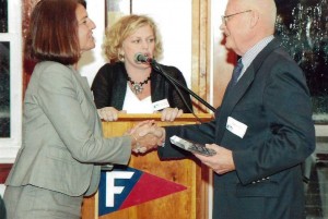 Executive Director Anne E. Connolly and FHT Board president, Addie Drolette honor Bob Murray with the Bruce Espey Community Service Award